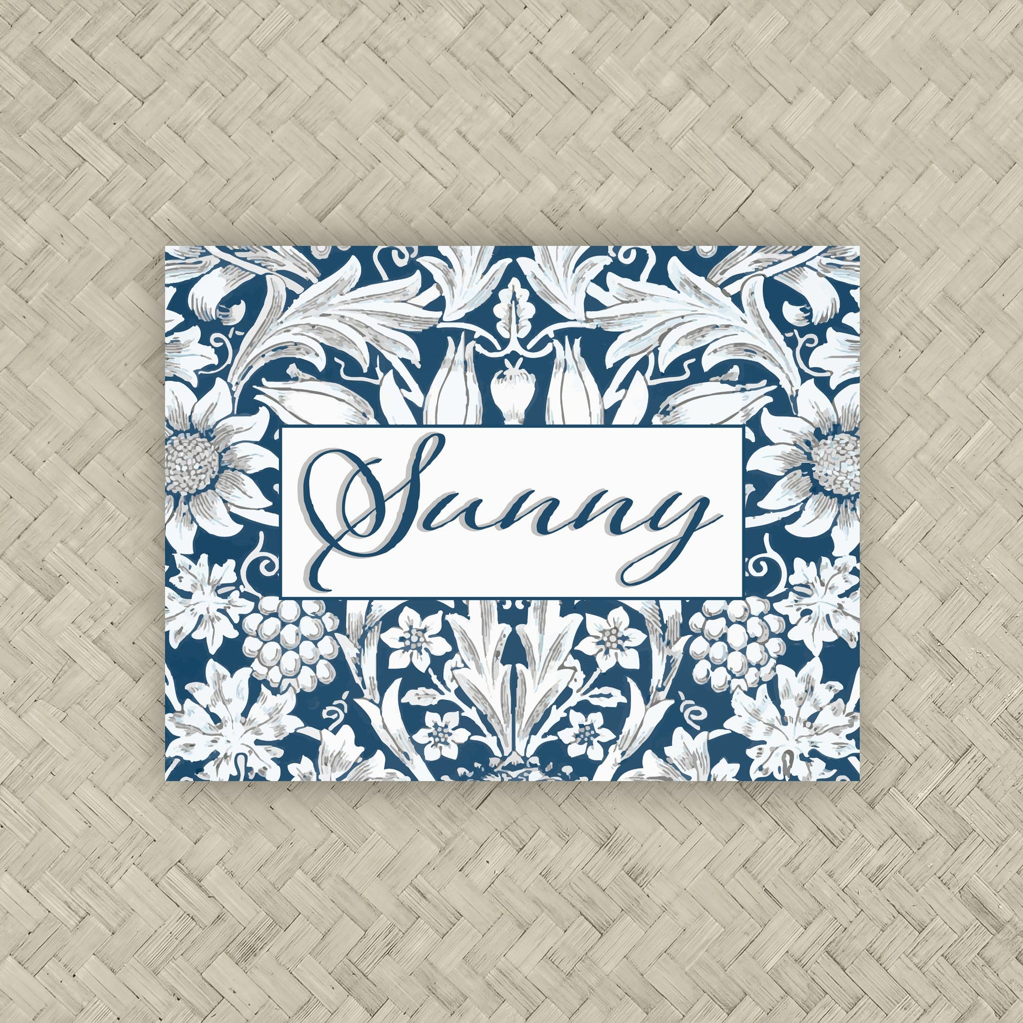 A NMJL Mahjong card cover sticker with a navy blue and white floral damask pattern, personalized with the name in dark blue script.